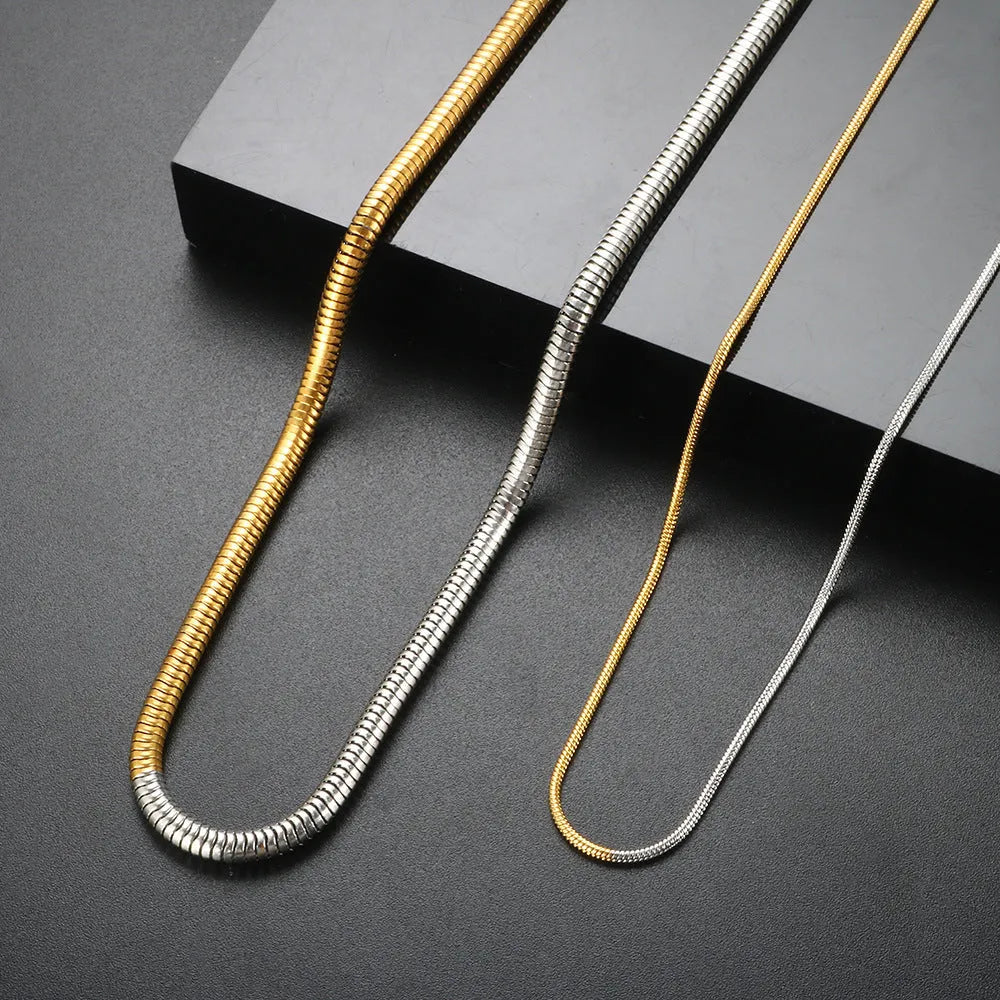 Gold-tone snake bone chain necklace with geometric lines and 3mm thick links