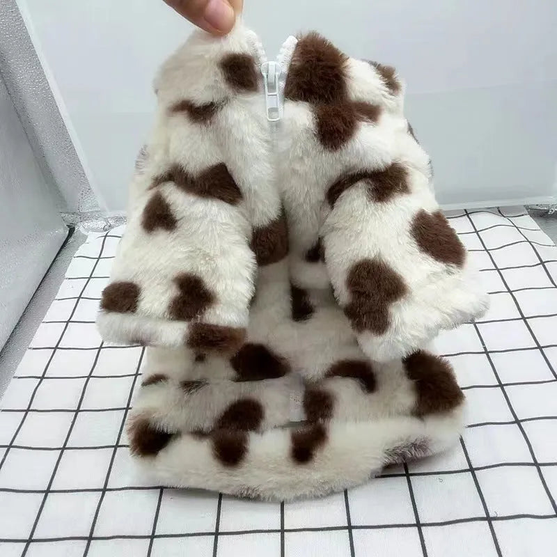 Small dog wearing British-style pink polyester plush winter coat suitable for Pomeranian or Bichon Frise breeds