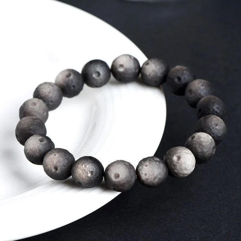 Natural obsidian crater ball bracelet with textured beads in silver meteorite finish