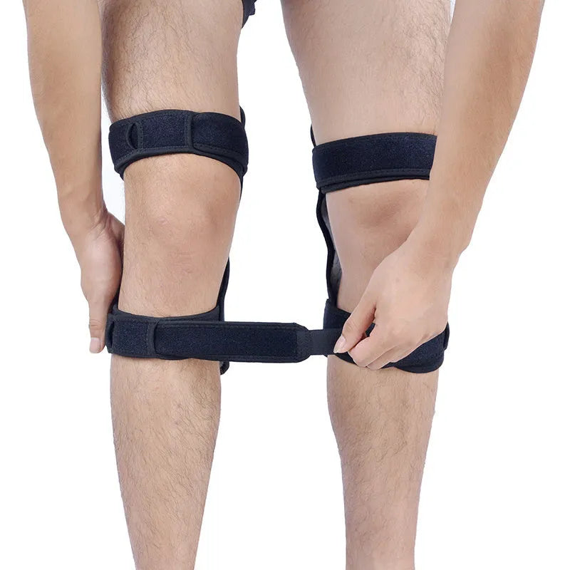 Adjustable spring-loaded knee support brace with straps on a grey background.