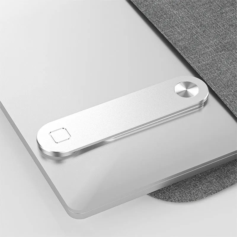 Black aluminium laptop phone holder with magnetic mount attached to monitor