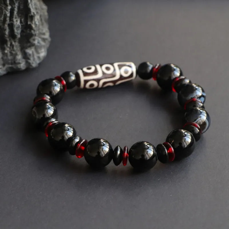 Black agate dzi bead bracelet with chalcedony stones and hand-woven design