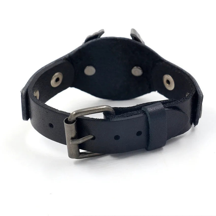Black leather geometric bracelet with alloy eagle watch-butttom closure, showing varying widths along 26cm length