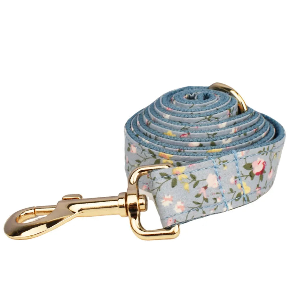 Floral dog collar set with matching leash, vest, and bow accessories in polyester cotton cloth