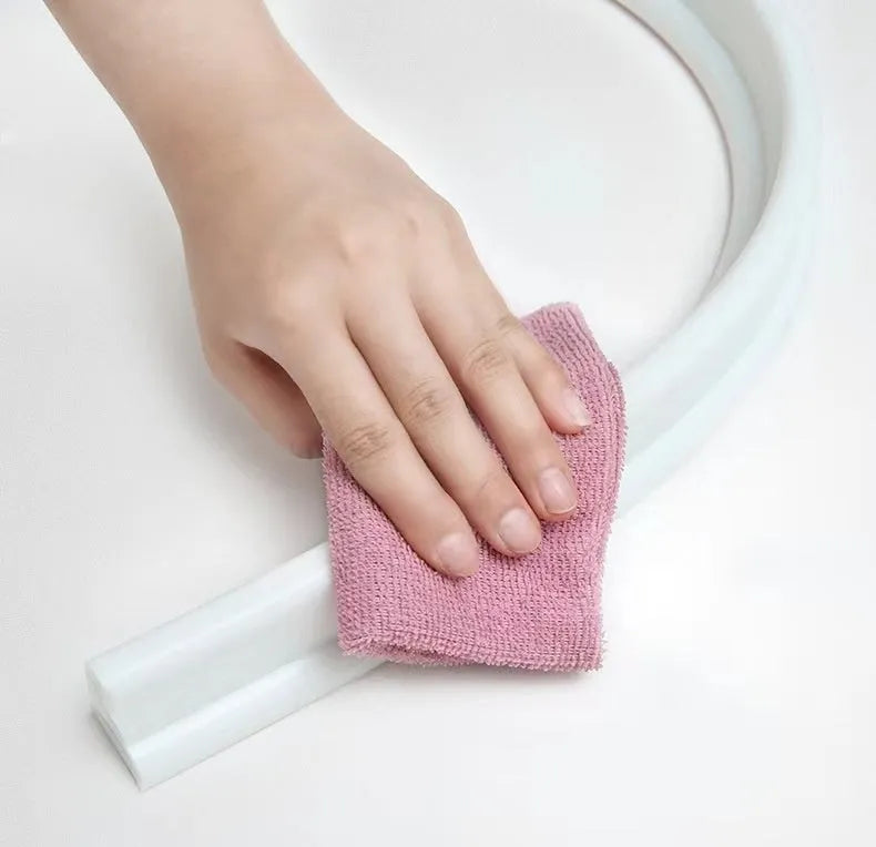 Flexible TPE silicone bathroom water blocking strip in black colour showing 30x40cm size for shower room floor water containment