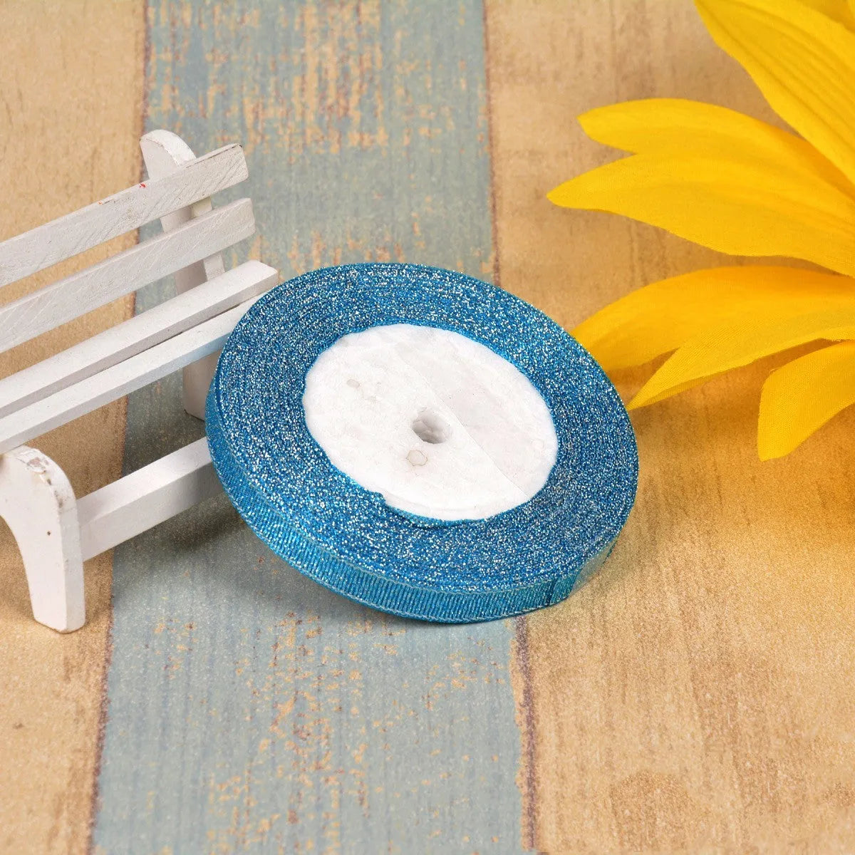 Green onion coloured polyester ribbon with gold polka dots on 25-yard spool for decorative trimming