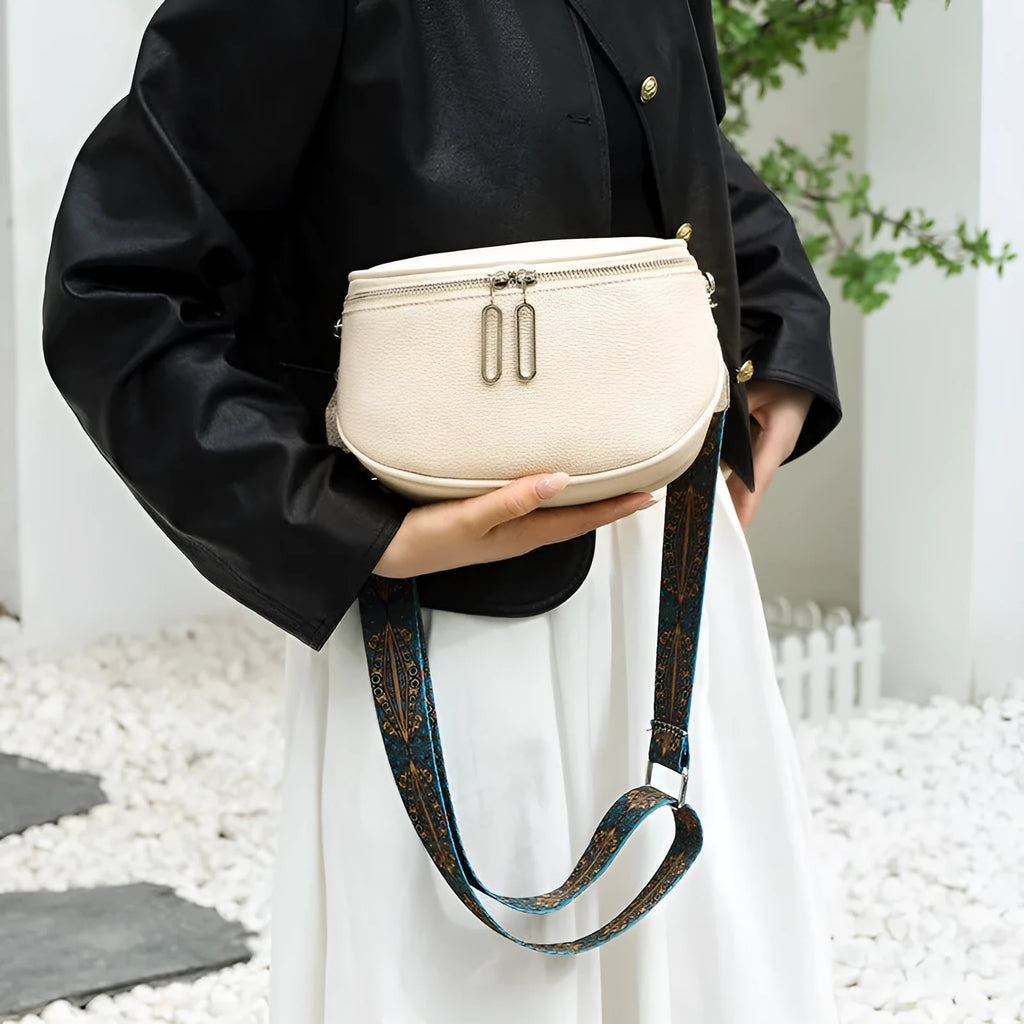 Women's soft PU leather messenger bag in saddle shape with single shoulder strap