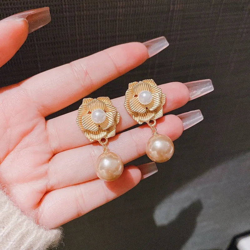 Gold colour stud earrings with ice flower pattern, rose pearl design, and central opal stone