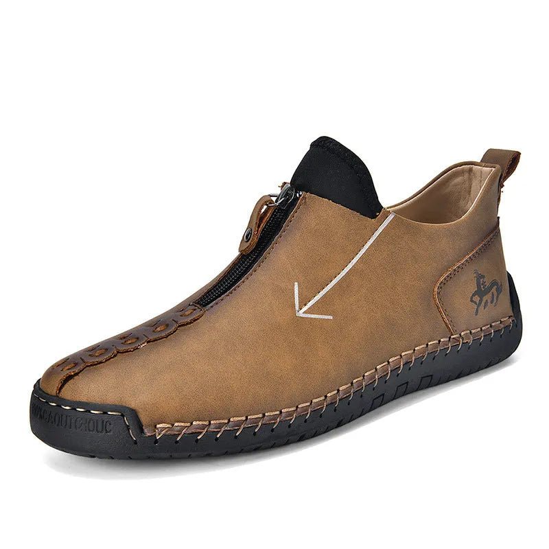 Men's black leather boots with front zipper and hand-stitched detailing, mid-calf height with low rubber sole