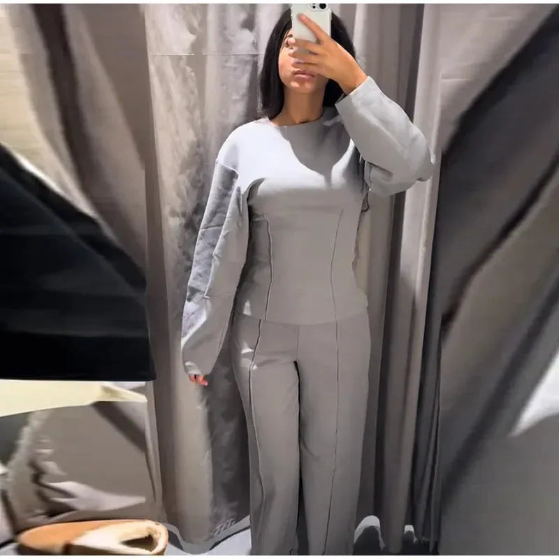 Women's black fleece suit set with O-neck pleated top and wide-leg trousers