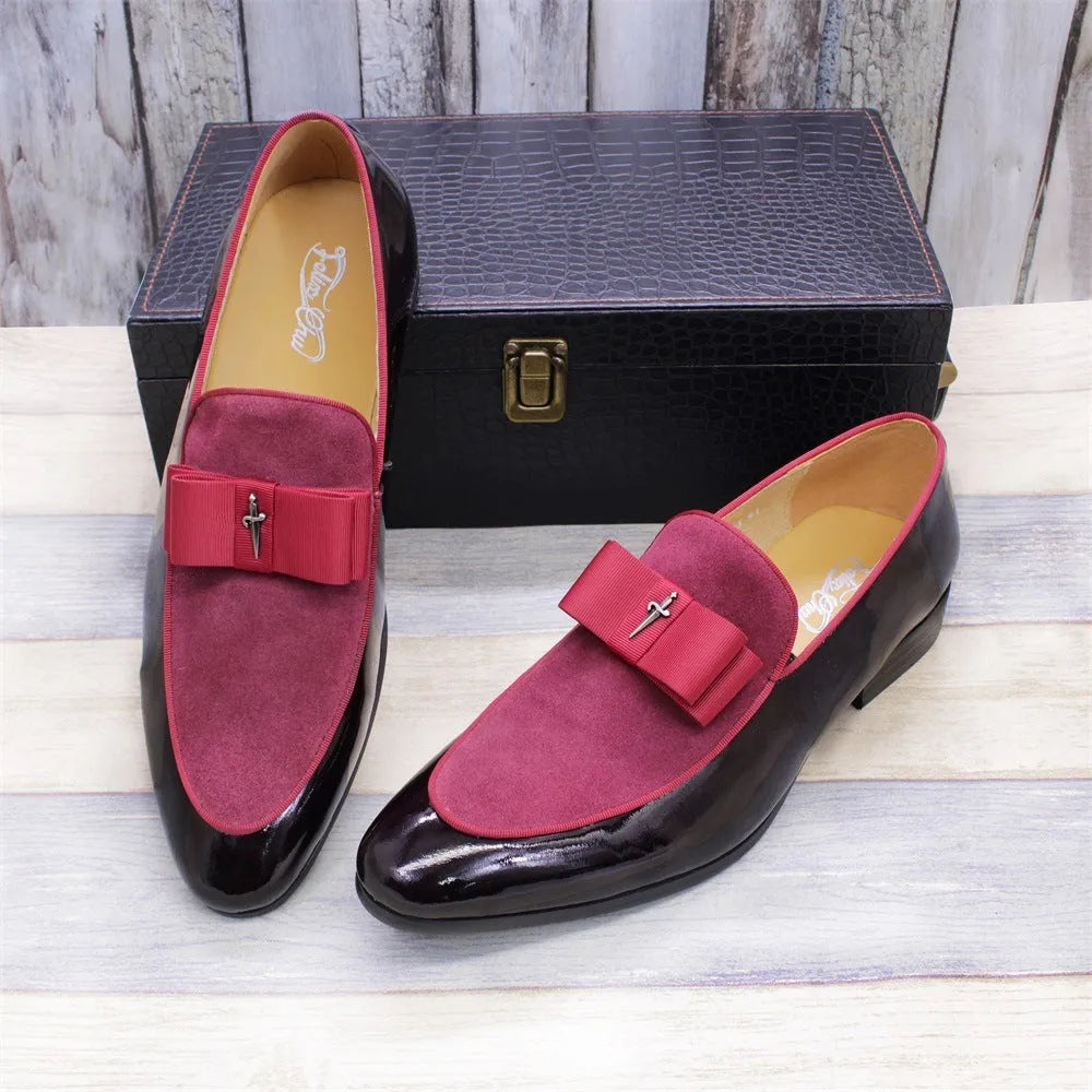 Men's black patent leather low-top shoes with a gold tassel detail on a white background.