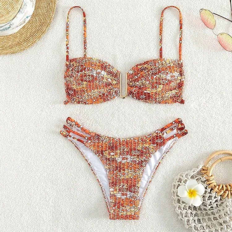 Women's floral bikini swimsuit with high-waisted briefs in solid orange colour