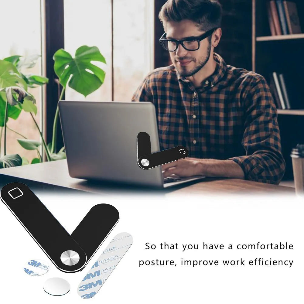 Black aluminium laptop phone holder with magnetic mount attached to monitor