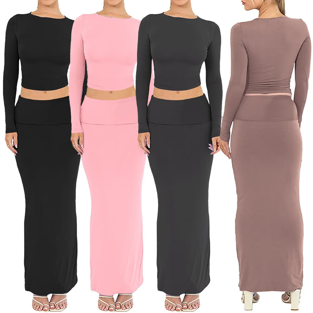 Women's sweet style two-piece suit with a cropped top and long skirt in polyester fabric.