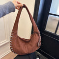 Soft plush underarm tote handbag in retro style showing black colour variant