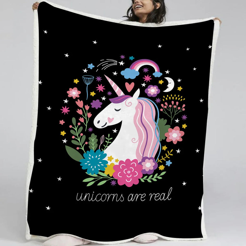 Black Sherpa fleece blanket with high weight, soft texture, and hemmed edges on a sofa