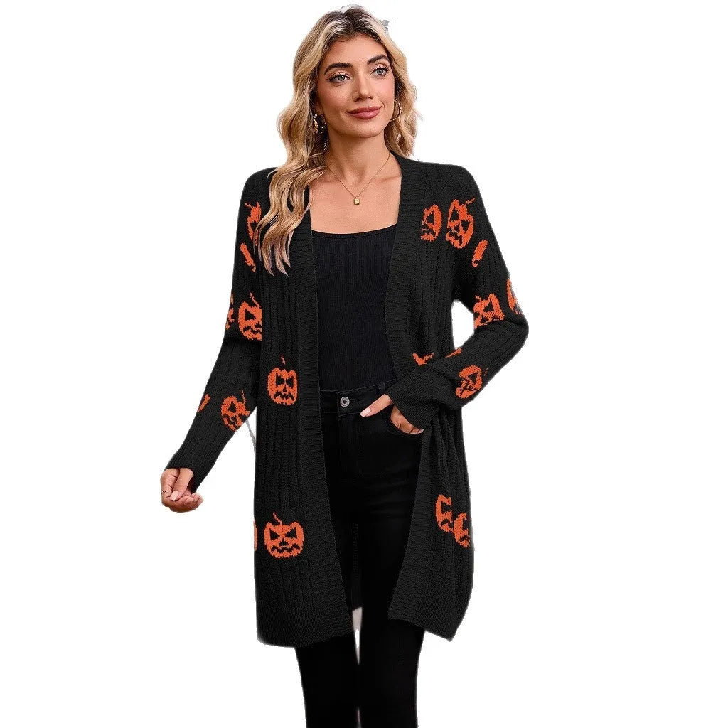 Women's black Halloween cardigan with orange pumpkin head jacquard knit pattern.