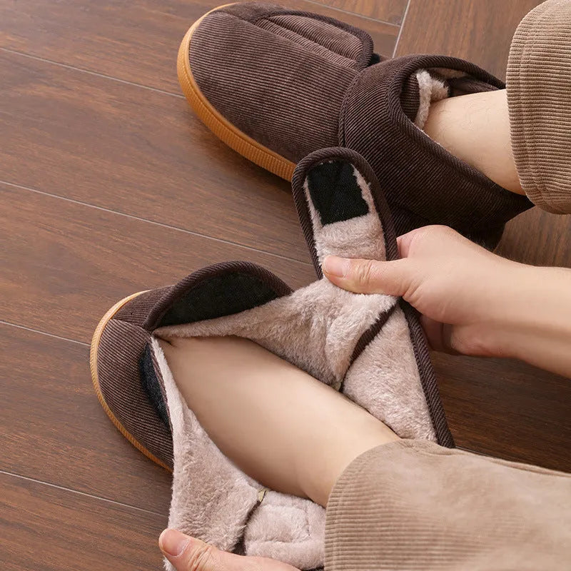 Large opening warm boots with anti-slip rubber soles, unisex slip-on design, plush upper and faux fur lining in black