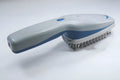 Negative ion pet grooming comb with removable brush head, measuring approximately 21.5cm long