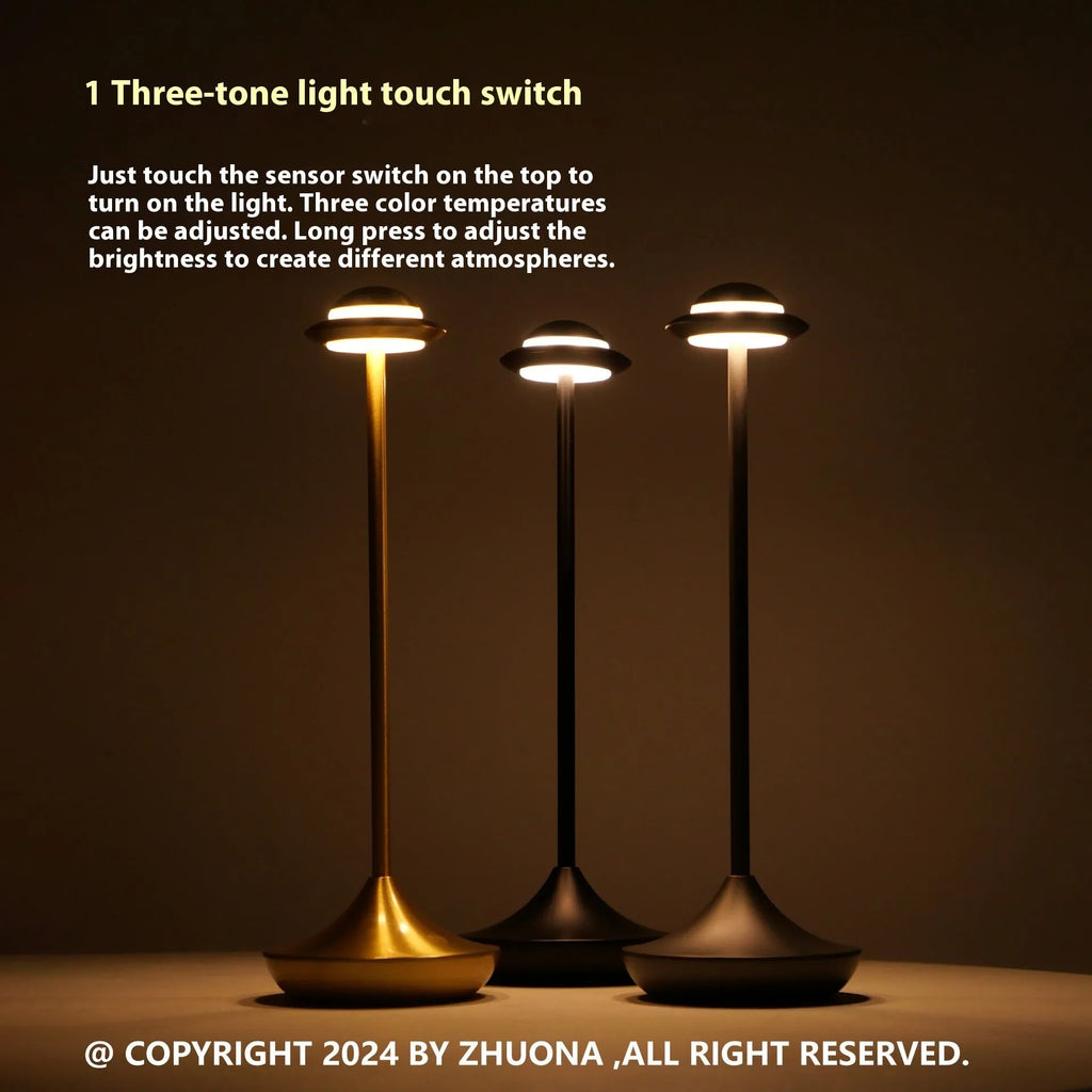 UFO-shaped metal table lamp with touch dimming control in gold, grey or black finish