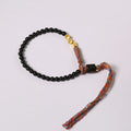Hand-woven obsidian carrying strap bracelet showing textured detail and adjustable 15.5-16cm length