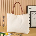 Beige white canvas tote bag with reinforced straps, shown flat and empty.