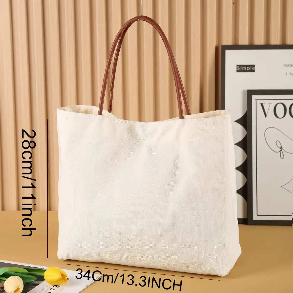Beige white canvas tote bag with reinforced straps, shown flat and empty.
