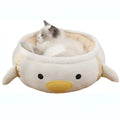 Green dinosaur-shaped cat bed shown both flat and hanging as a hammock for small cats.