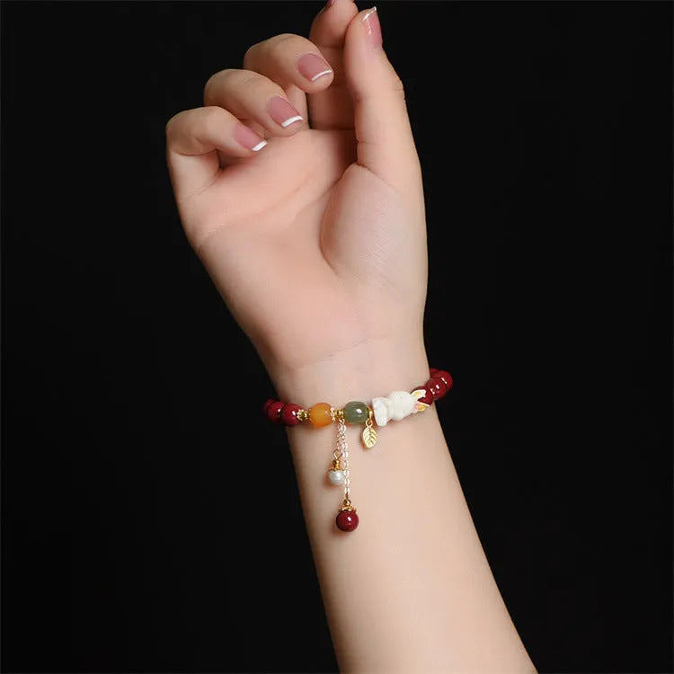 Traditional Chinese cinnabar bracelet with rabbit charm in 8mm or 10mm bead sizes