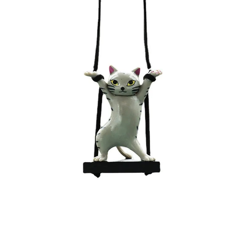 Resin cartoon cat pendant for car interior decoration on a rope, shown in multiple colour options.