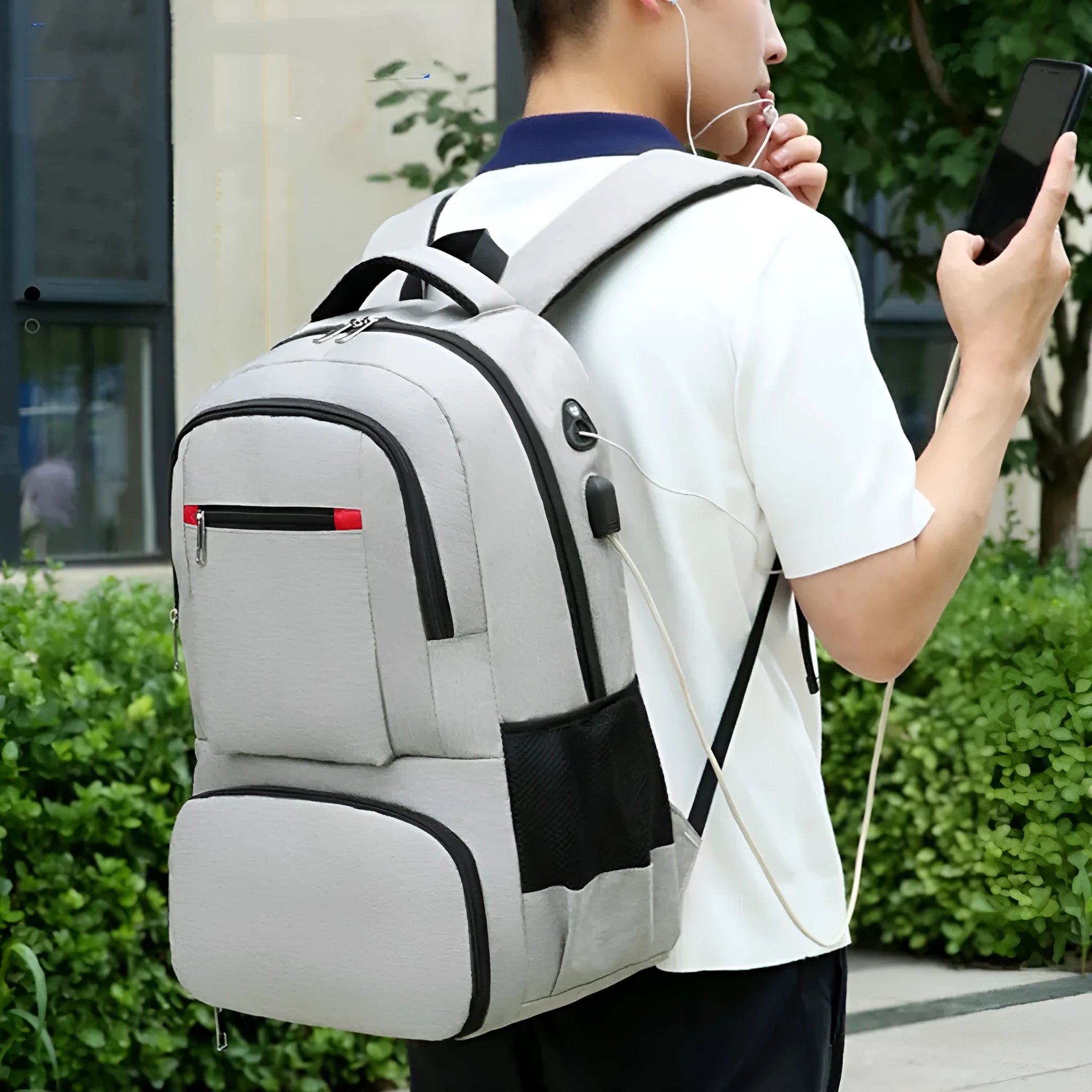 Light grey Oxford cloth insulated picnic backpack with curved shoulder straps showing dry-wet separation compartments