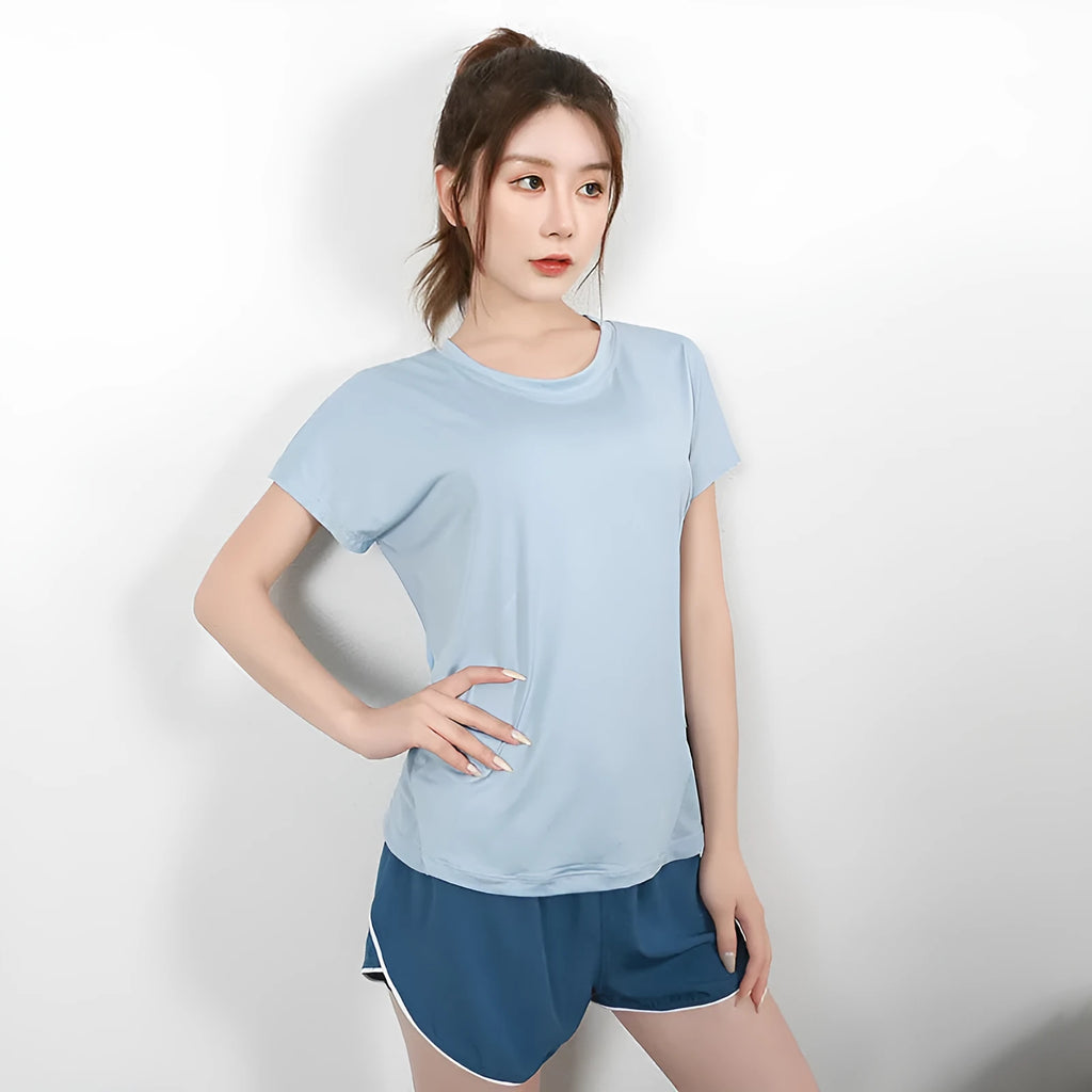 Women's polyester sports t-shirt in pink colour with short sleeves for yoga and running activities