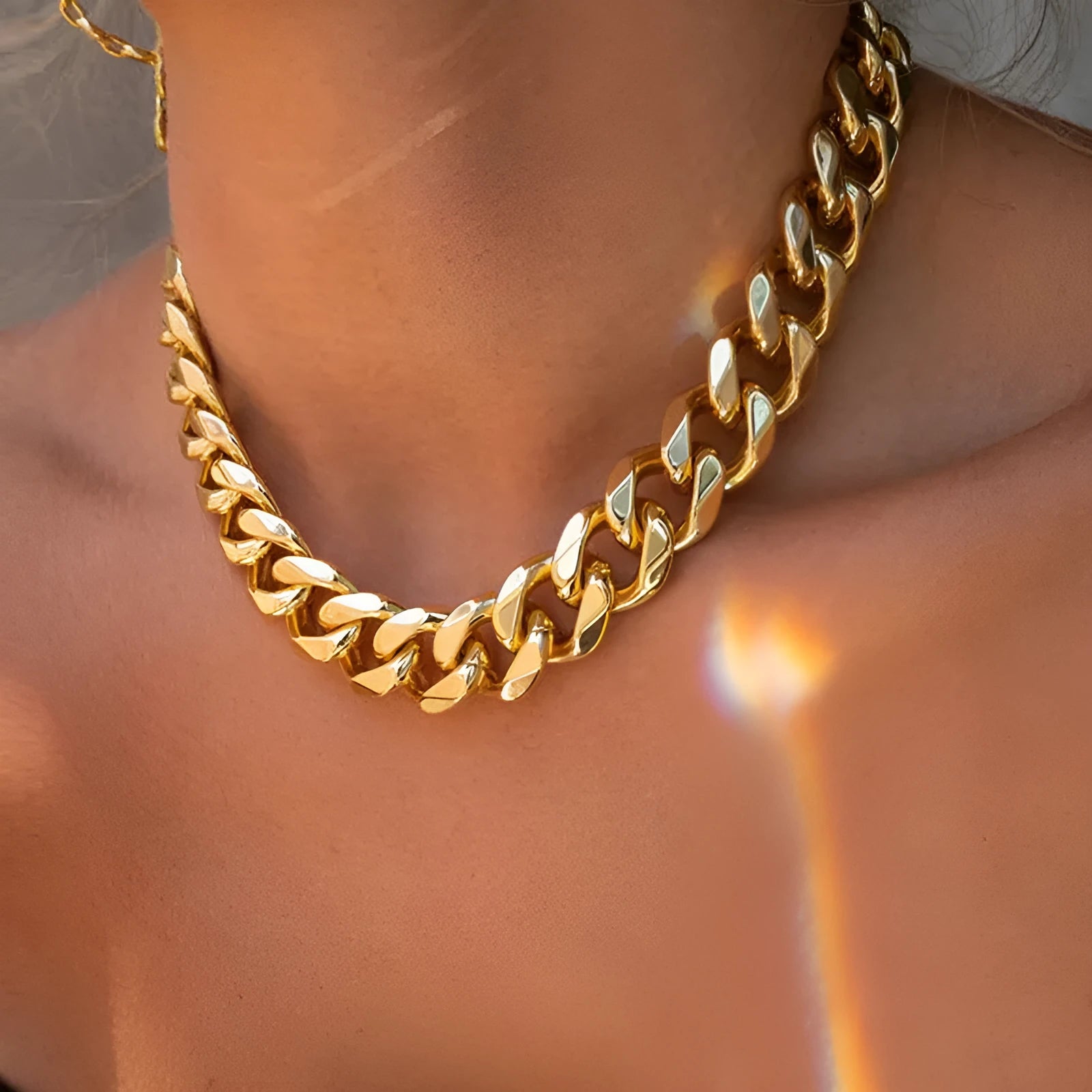 Women's gold thick chain necklace showing 32cm length with 6cm pendant detail