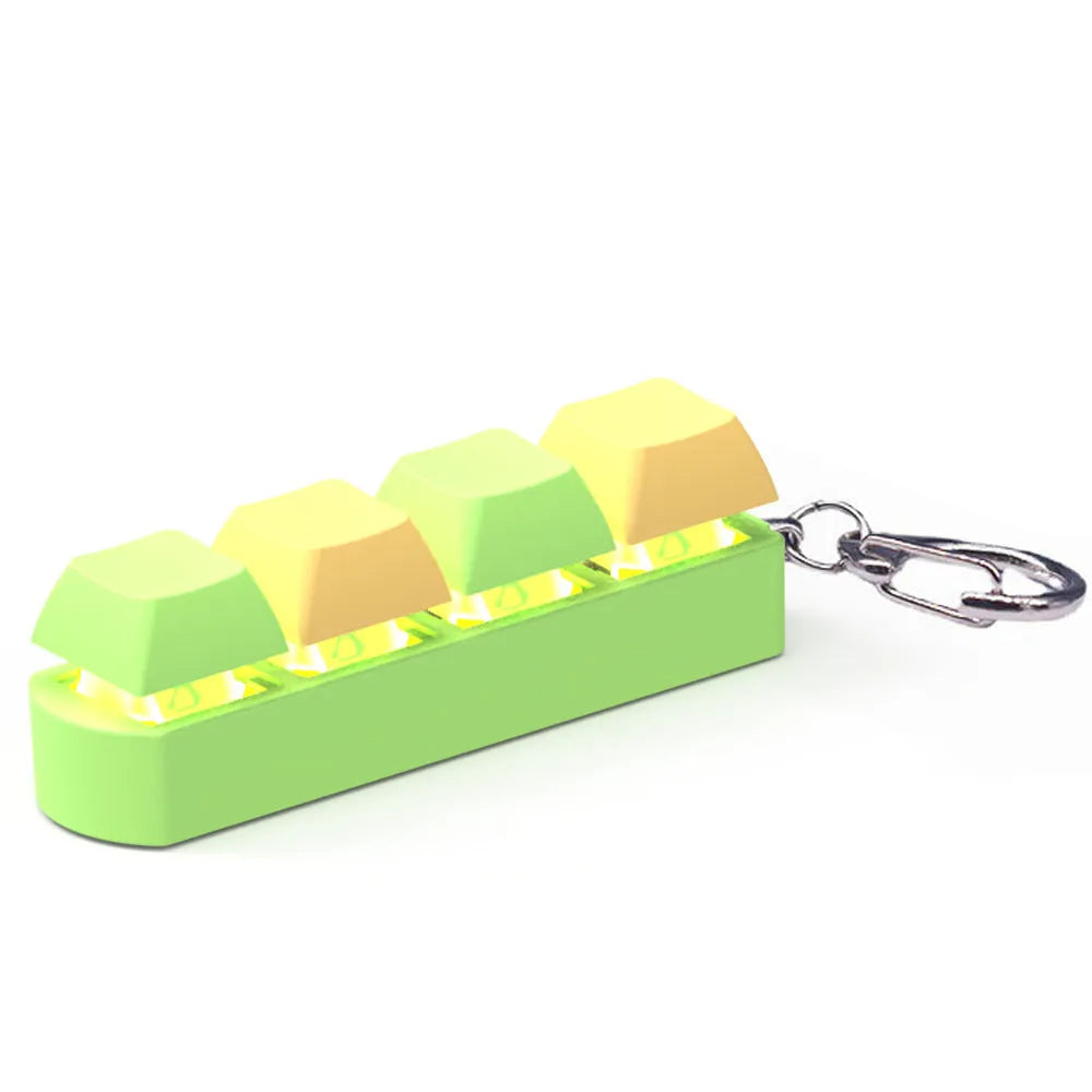 Compact 4-key mechanical keyboard switch tester on a desk, showing coloured ABS plastic construction.