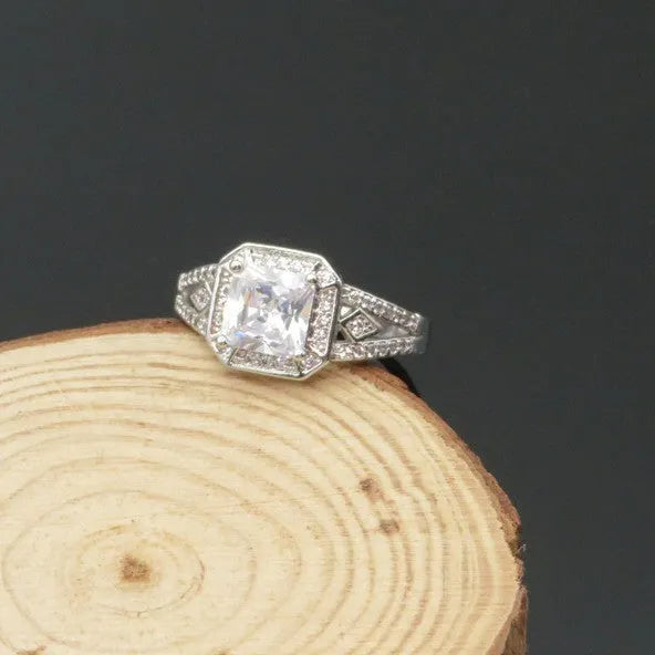 Women's geometric hollow zircon ring in platinum colour showing quadrilateral design and inlaid stones