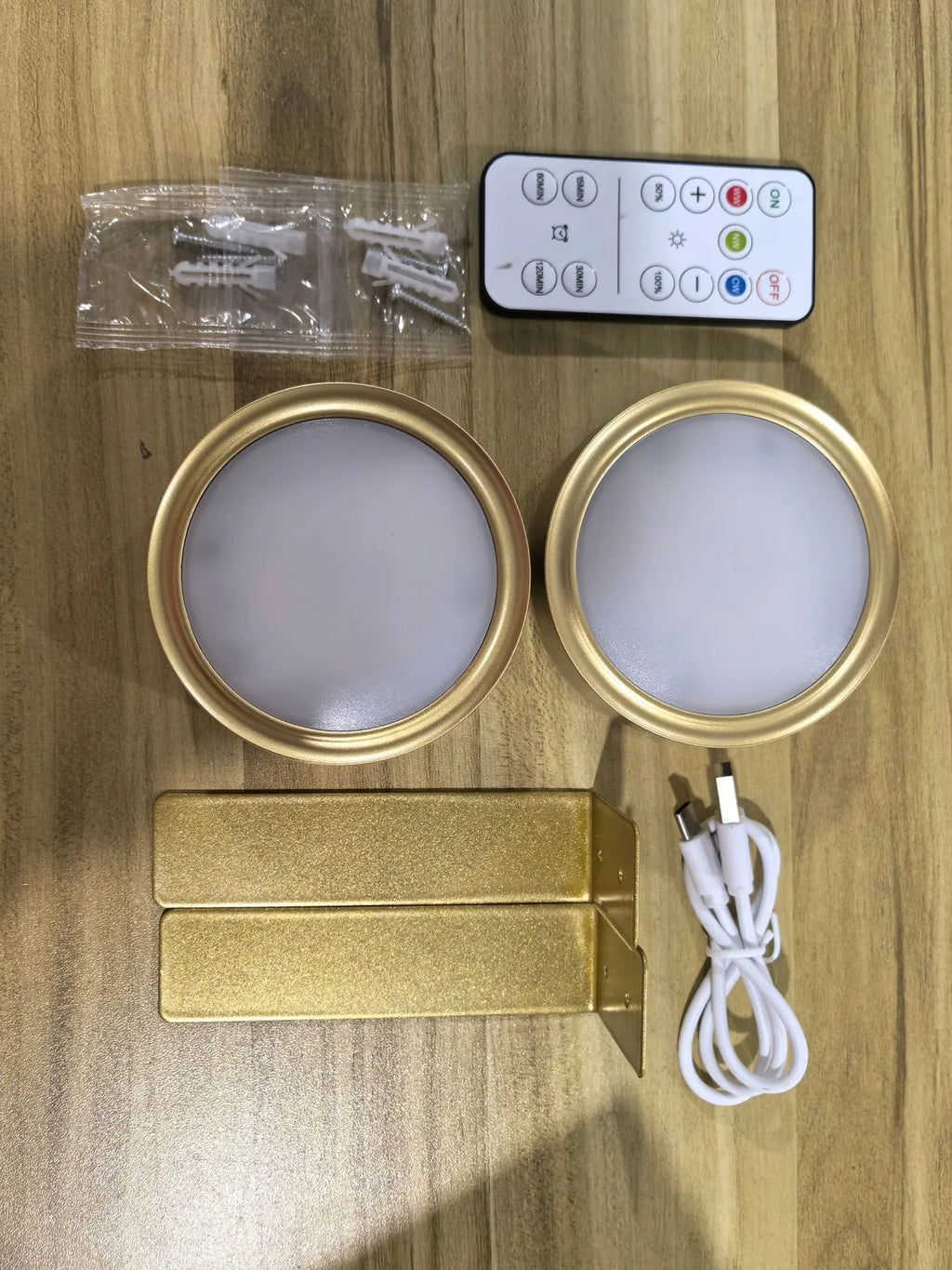 Wireless magnetic LED painting light in black, mounted on wall with remote control.