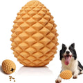Yellow natural rubber pine cone dog chew toy with treat dispenser hole on a white background.