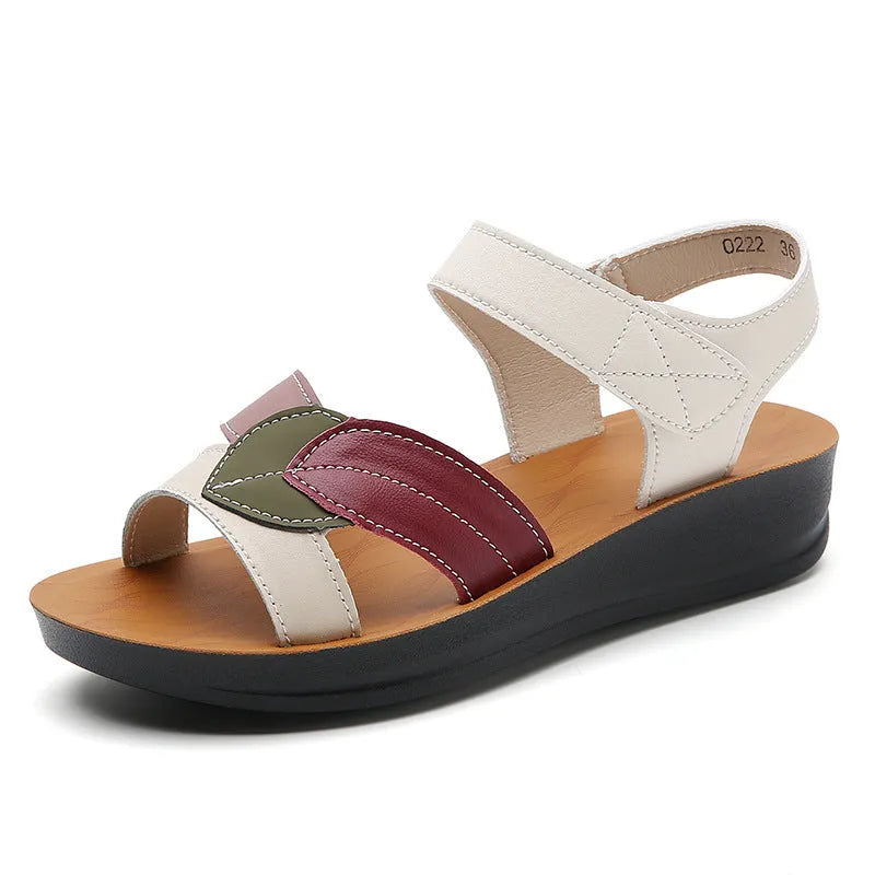 Women's thick-soled Velcro sandals in beige with side hollow design and colour blocking on a flat surface