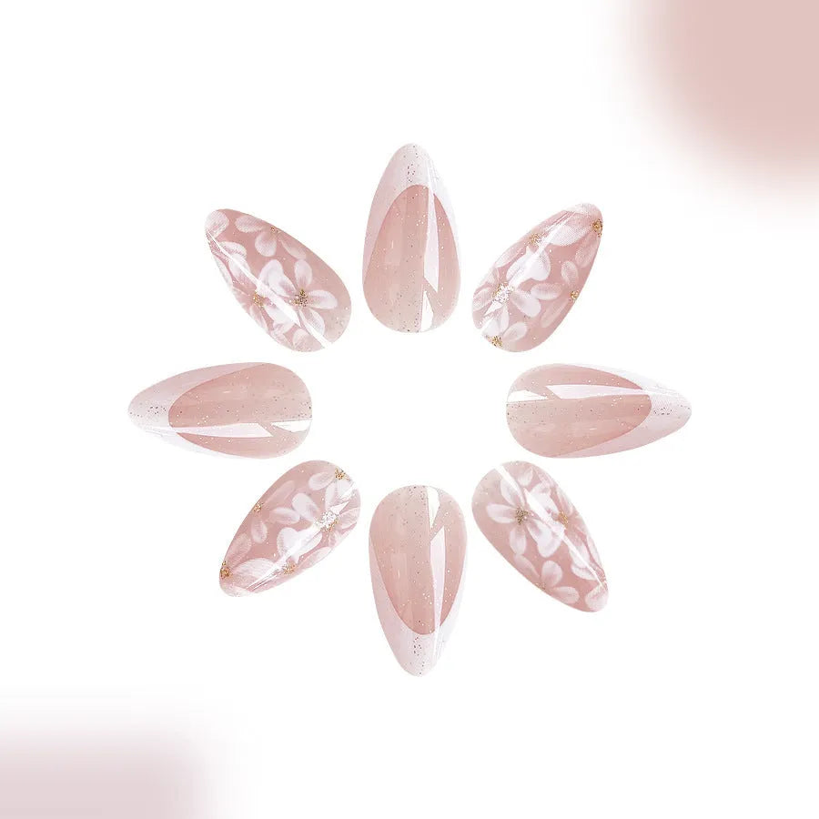 C625 short glossy almond fake nails with French manicure, glitter, and pink powder flowers.
