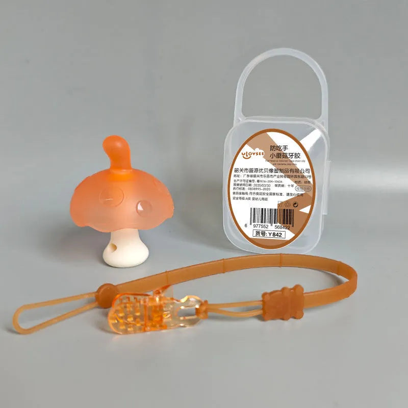 Small mushroom-shaped food grade silicone gel charm in pink or nano colour with chain attachment