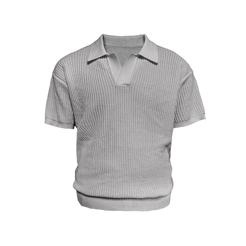 A creamy-white loose-fit polo shirt with a striped collar and short sleeves on a hanger.