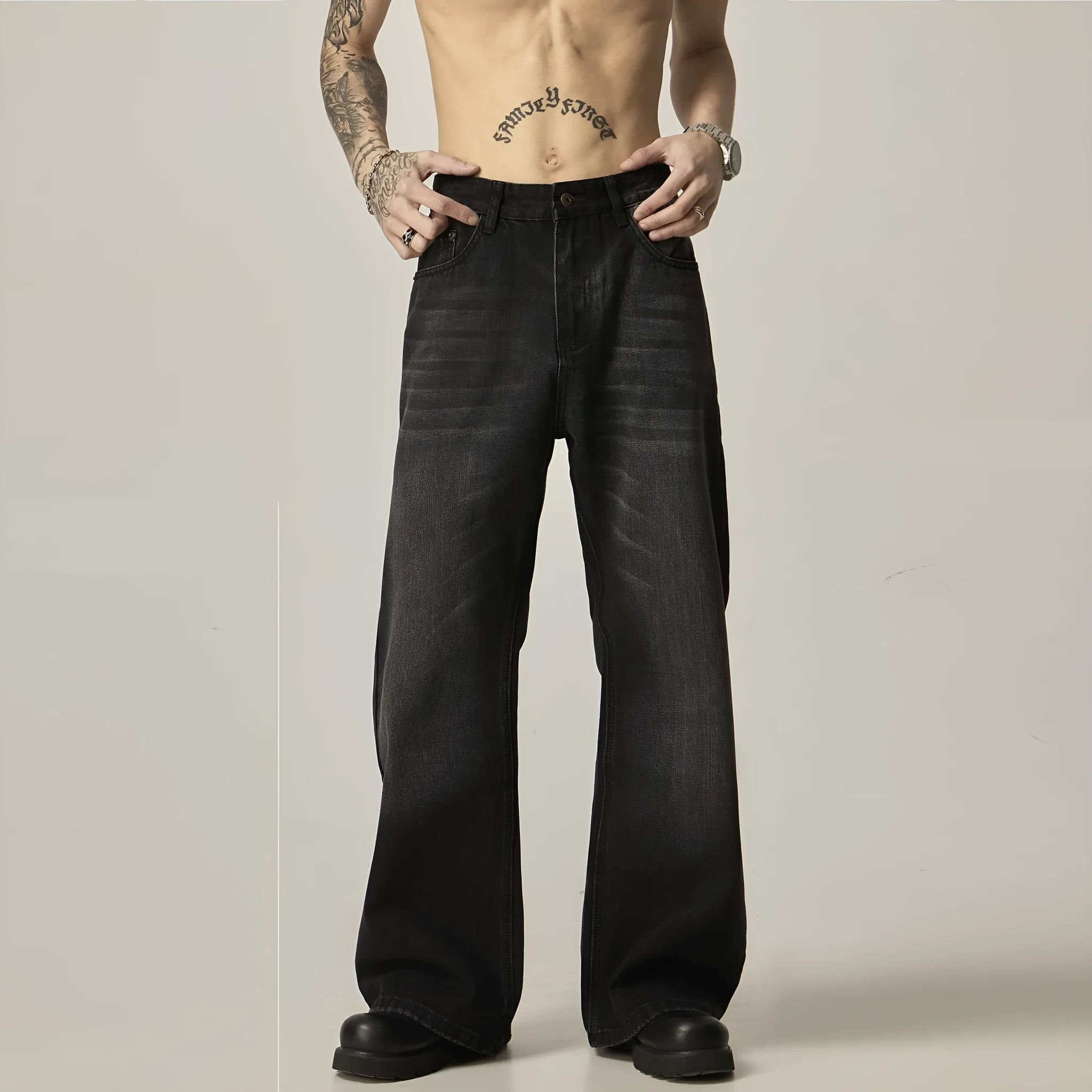 Black retro straight leg jeans with loose fit and zipper fly on hanger