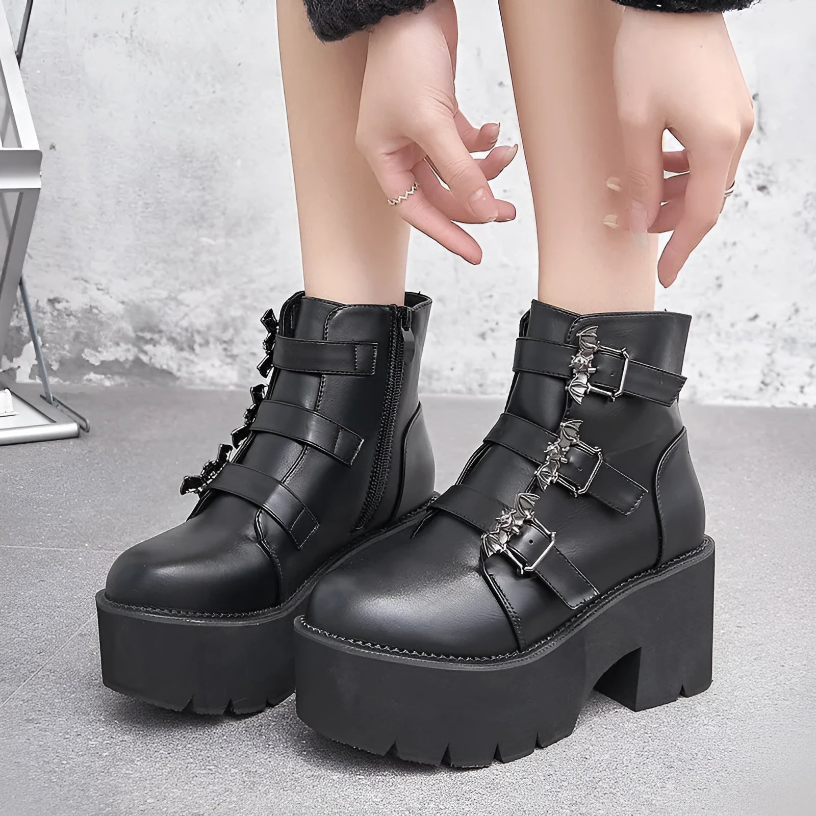 Black women's punk bat buckle gothic short boots with side zip and thick heel.