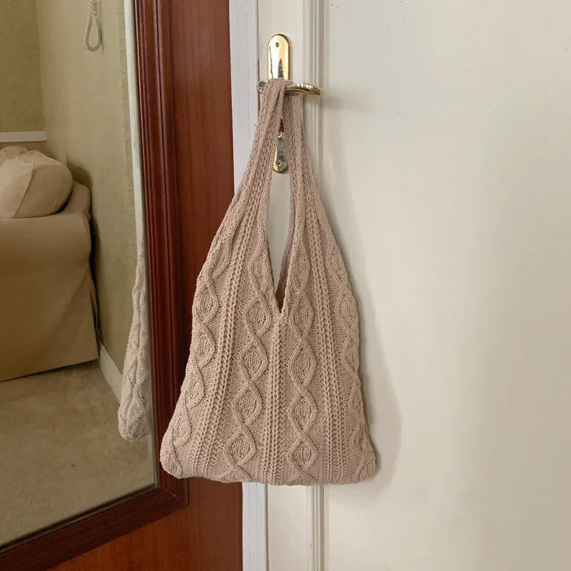 Retro hollow-knitted shoulder tote bag in solid colour with double straps showing textured yarn construction