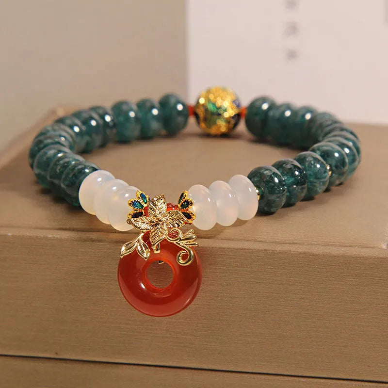 Women's crystal bracelet with blue water jade and red agate beads featuring safety buckle closure
