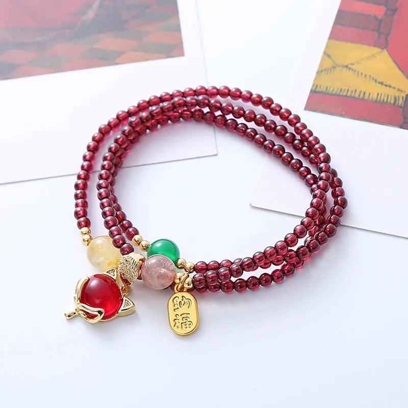 Purplish red garnet crystal fox charm bracelet with adjustable rope design