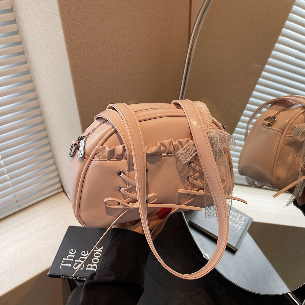 Women's fashion shoulder handbag with bandage bow design in PU leather showing interior phone pocket