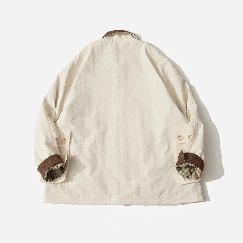 Green casual polyester jacket with long sleeves and side seam pockets on a hanger.
