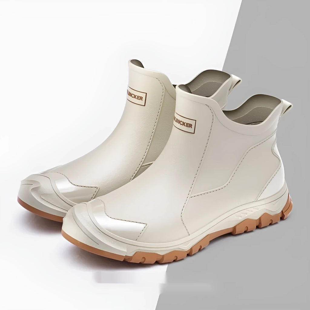 Pair of solid colour low tube PVC wading shoes with a round toe and non-slip plastic sole.