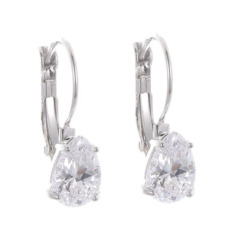 Women's drop-shaped copper earrings with gold finish and decorative platinum inlay.